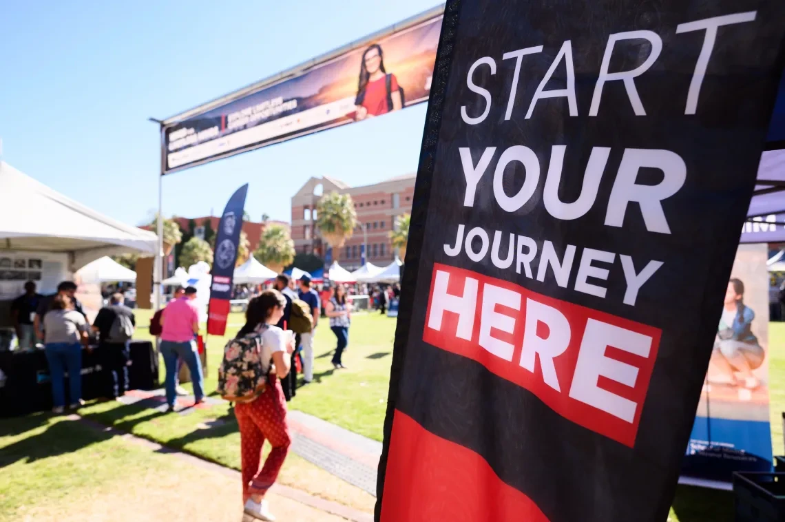 outdoor festival, start your journey here banner in foreground