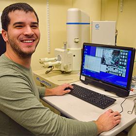 Grad student using the SEM lab